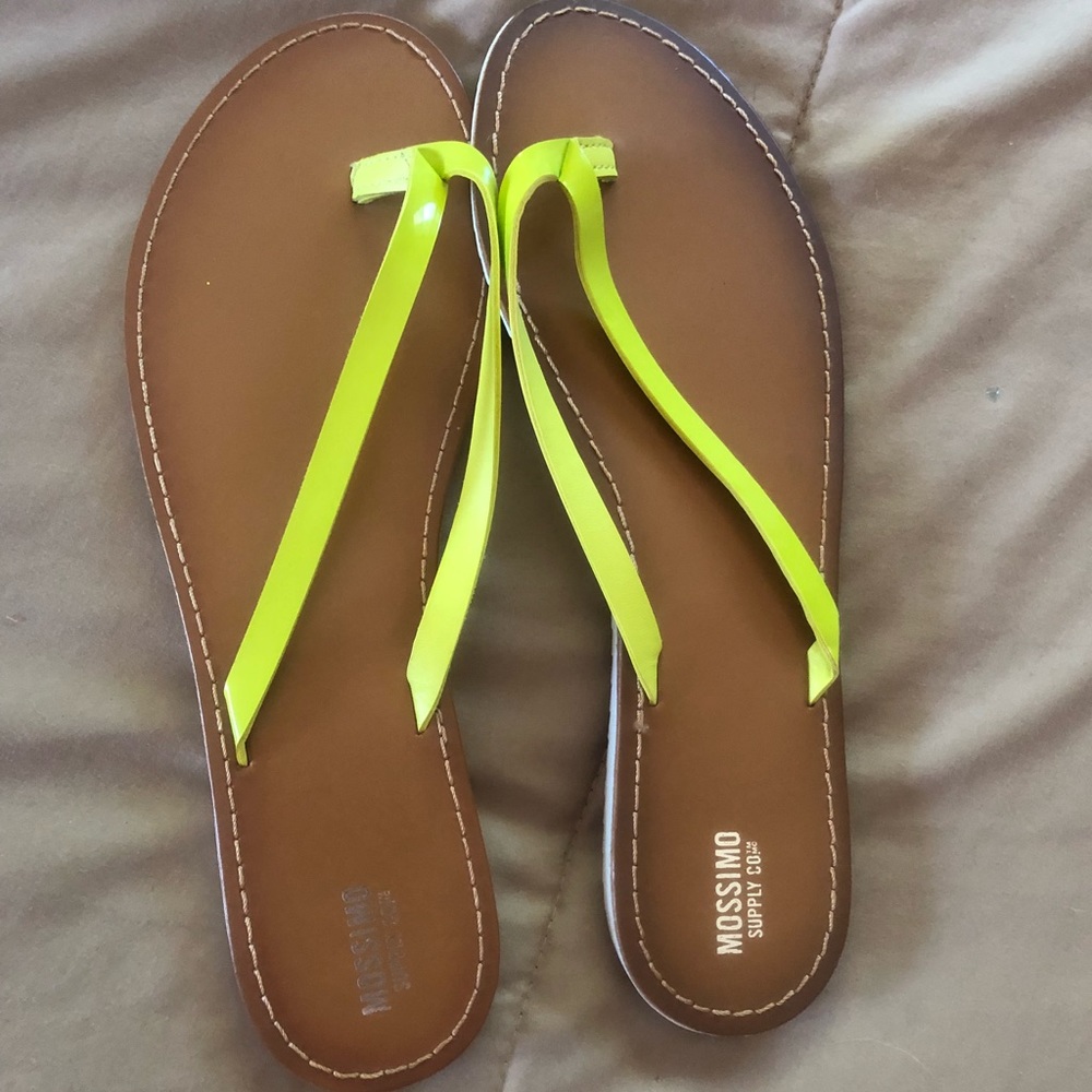 Bright yellow leather flip-flops.